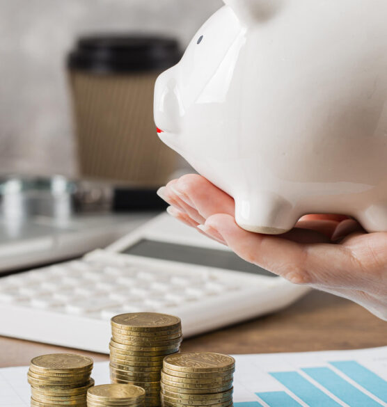 hand-holding-piggy-bank-with-growth-chart-coins