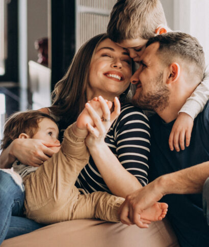 young-family-with-their-sons-home-having-fun