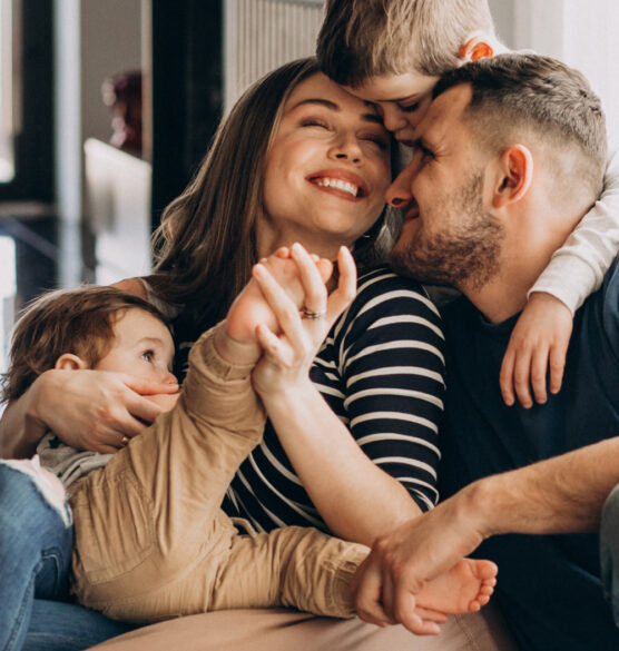 young-family-with-their-sons-home-having-fun